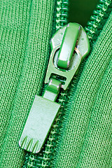 Image showing zipper of a green sweater