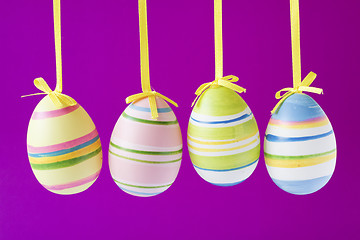 Image showing easter eggs  on purple background