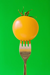 Image showing fork with yellow tomato