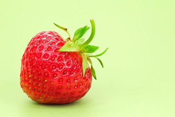 Image showing strawberry over a green background