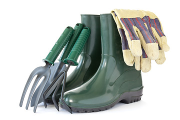 Image showing  rubber boots with garden tools