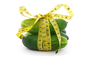 Image showing cucumbers with yellow measure tape