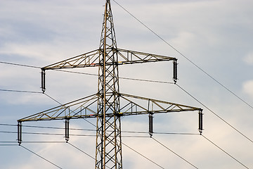 Image showing Electrical pylons against blue sky