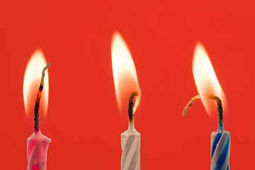 Image showing birthday candles on a red background