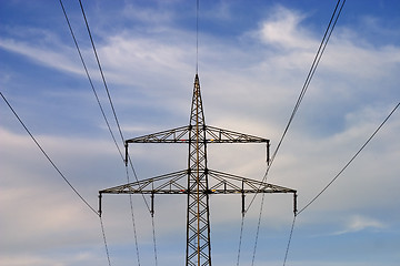 Image showing Electrical pylons against blue sky
