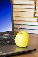 Image showing laptop with yellow apple