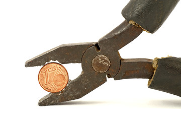 Image showing Euro cent squeezed in pliers