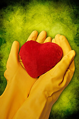 Image showing hands with heart on green background