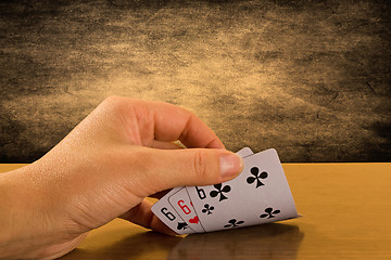 Image showing  Player hand revealing triple six