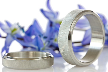 Image showing rings with flowers in the background 