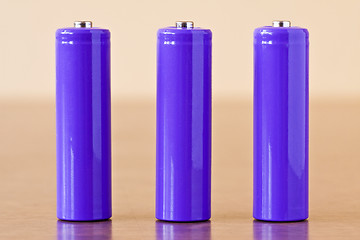 Image showing three purple alkaline batteries