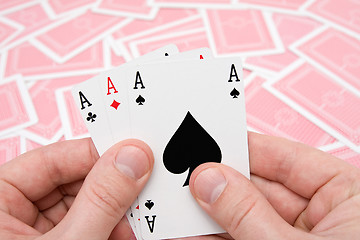 Image showing hands with three aces