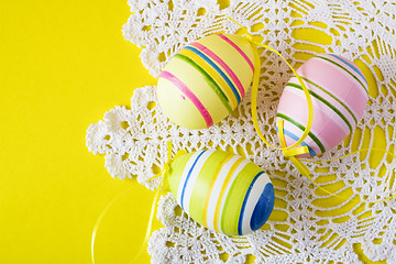 Image showing colorful easter eggs on white serviette