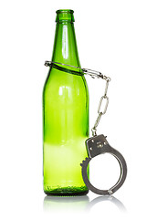 Image showing Bottle and handcuffs
