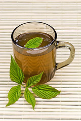 Image showing tea and green leaves