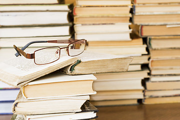 Image showing glasses on stack of books