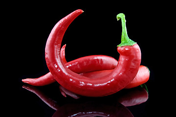 Image showing peppers on black background