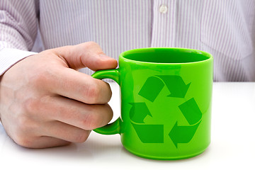 Image showing hand hold a  cup with recycled symbol