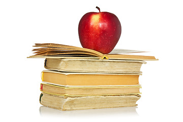 Image showing Red apple and stack of books