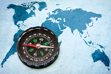 Image showing compass on the blue world map