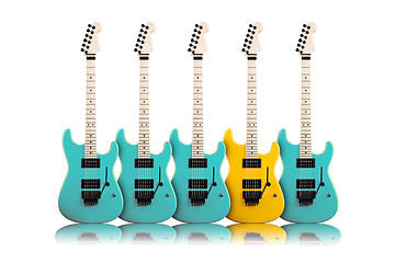 Image showing yellow guitar in a middle of blue