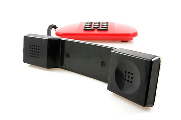 Image showing red telephone with black receiver