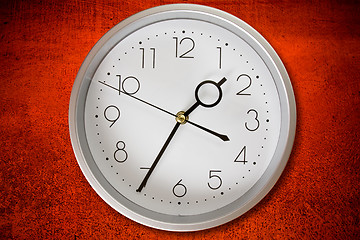 Image showing clock on a dirty red wall