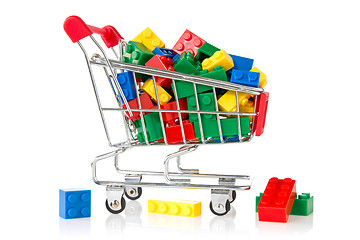 Image showing color plastic bricks  in a shopping cart