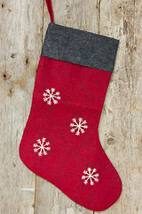 Image showing christmas sock hung on the wooden wall