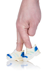 Image showing Fingers  wearing sports trainers