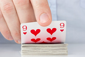 Image showing hand revealing nine of hearts