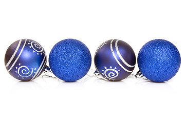 Image showing four blue cristmas baubles