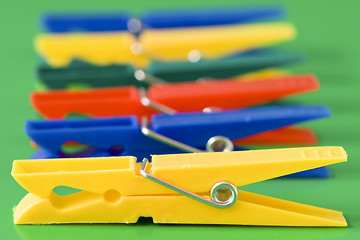 Image showing row of colorful clothespins