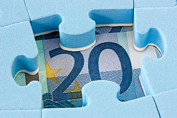 Image showing Blue puzzle on Euro currency