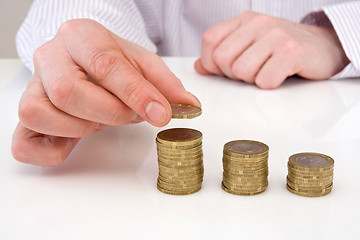 Image showing hand putting coins