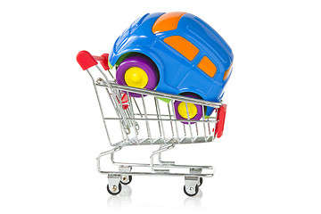 Image showing plastic toy car in a shopping cart 