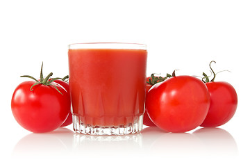 Image showing ripe tomatoes and glass of tomato juice