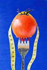 Image showing fork with tomato and measure tape