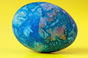 Image showing blue easter egg  on yellow background