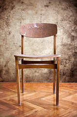 Image showing wooden chair in a dirty room