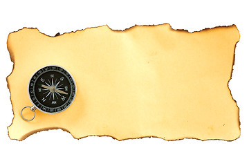 Image showing compass on the piece of burnt paper