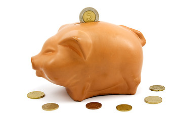 Image showing brown piggy-bank and coins