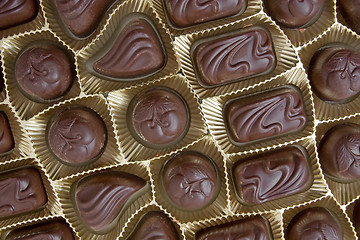 Image showing  chocolate pralines in a golden box