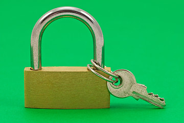 Image showing padlock with keys on green background