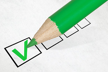 Image showing Green pencil marking check box
