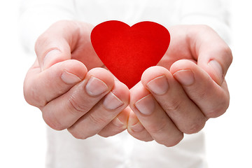 Image showing holding a red heart in hands