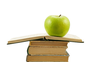 Image showing open book with green apple