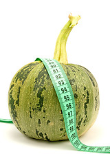 Image showing Round zucchini with measuring tape
