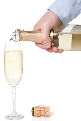 Image showing hand pouring champagne in a glass