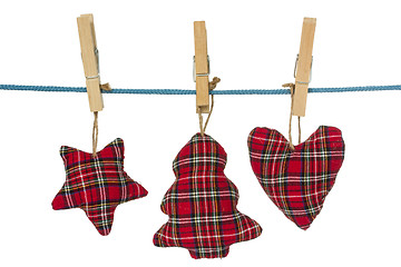 Image showing Christmas decorations hang on the clothesline